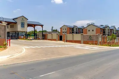 an empty street with houses in the background at #AlimamaSpaces The Chelsea Kyalami Woods in Midrand