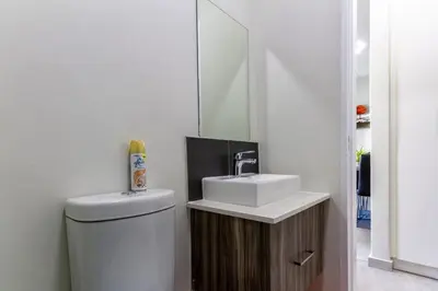 a bathroom with a sink and a toilet at #AlimamaSpaces The Bob's Kyalami Woods in Midrand