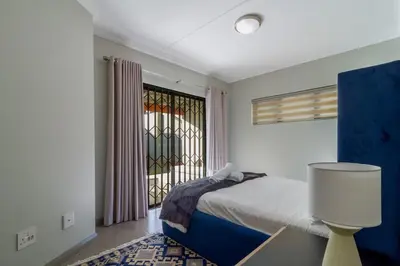 a bedroom with a bed and a window at #AlimamaSpaces The Manson Umthunzi View in Vosburg