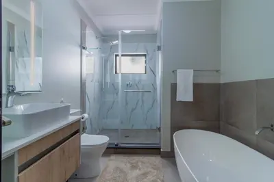 a bathroom with a sink toilet and a shower at #AlimamaSpaces The Manson Umthunzi View in Vosburg