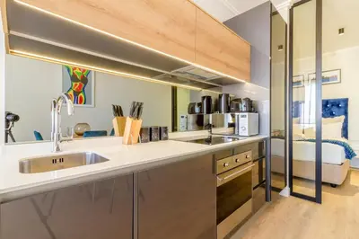 a kitchen with a sink and a counter top at #AlimamaSpaces The Chelsea's Cassini Ellipse in Vosburg