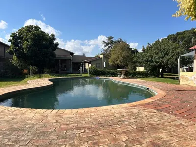 a pool of water on a brick driveway at C'est Si Bon Accommodation at 53 Van Heerden Mokopane in Mokopane