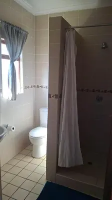 a bathroom with a toilet and a shower curtain at C'est Si Bon Accommodation at 03 Beitel, Mokopane in Mokopane