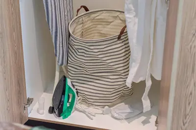 a bag sitting on a shelf in a closet at Capital City Luxury Apartment 830 Menlyn Maine in Pretoria