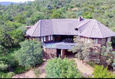 an aerial view of a large house in the forest at Mafuta Lodge - Mabalingwe Nature Reserve in Warmbaths