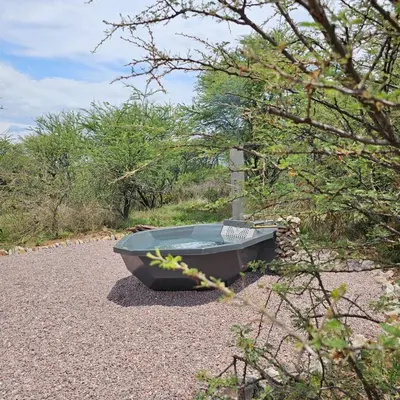 a small boat sitting on the side of a road at Rupping Bush Retreats in Mmukubyane