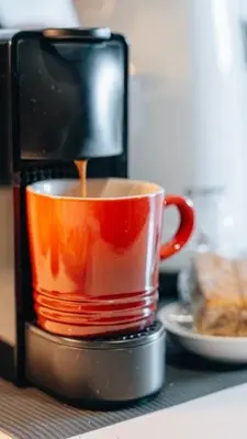 a coffee maker is making a cup of coffee at Urban Gem on 18th Prime Location in Pretoria
