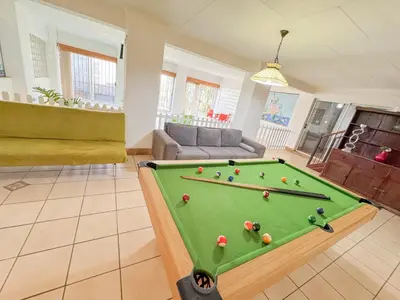 a living room with a pool table at Berry Bliss Haven in Pretoria