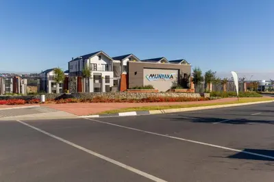 an empty street in front of a large house at AlimamaSpaces The Chelsea's Munyaka in Midrand