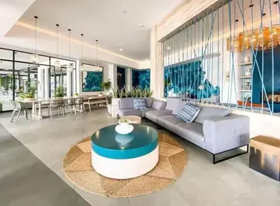 a living room with a couch and a table at Mish at The Blyde Crystal lagoons in Pretoria
