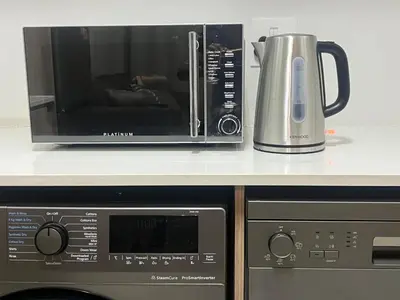 a microwave sitting on a counter next to a appliance at Mish at The Blyde Crystal lagoons in Pretoria