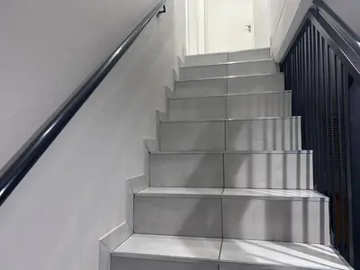 a stairway with a metal railing next to a building at Private Space in a House in Pretoria