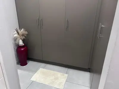 a room with two gray cabinets and a red fire hydrant at Private Space in a House in Pretoria