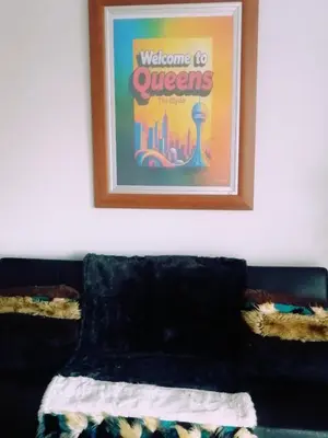 a picture hanging on a wall above a couch at Queens at The Blyde Lagoon in Pretoria