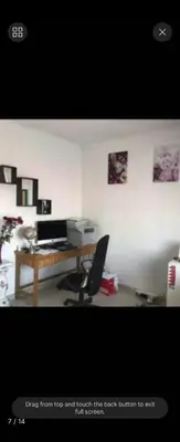 a room with a desk with a computer and a chair at Erasmia on main in Centurion