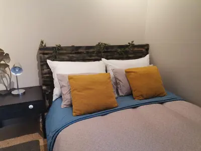 a bed with pillows on it in a room at The Centurion Sunset in Centurion