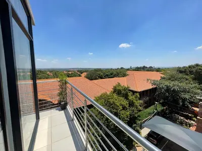 a balcony with a view of a roof at The Centurion Sunset in Centurion