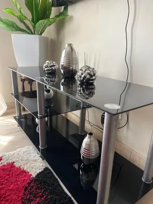 a glass table with four glass spheres on it at Modern Style Apartments, An Escape From The City in Pretoria