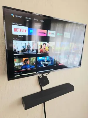a flat screen tv hanging on a wall at Bella Cottage in Centurion