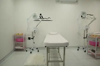 a hospital room with a white table and chairs at Marble Nights Guesthouse and spa Elim in Elim