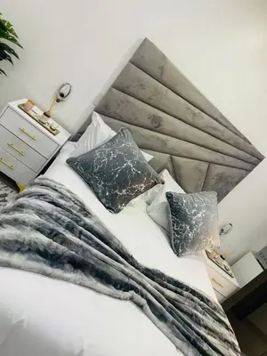 a bedroom with a white bed with pillows at Marble Nights Guesthouse and spa Elim in Elim