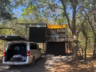 a white van parked in front of a tree at Harties Damview Resort in Hartbeespoort
