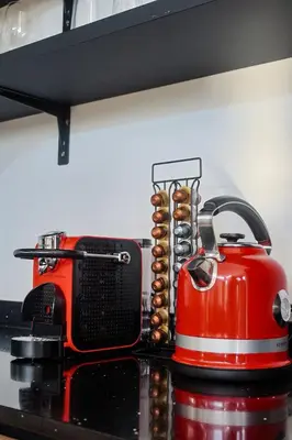 a red toaster sitting on top of a kitchen counter at Amani Luxury Villa Marloth Park in Marloth Park