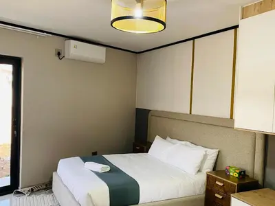 a hotel room with a bed and a window at Alldays Country Lodge in Alldays