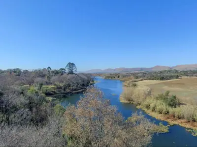 an aerial view of a river in a field at La Serenita @ Migdash in Hartbeespoort