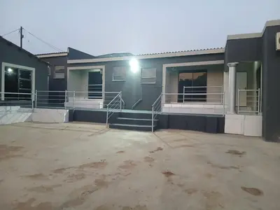 a house with a driveway in front of it at Baraba's guest house in Nelspruit