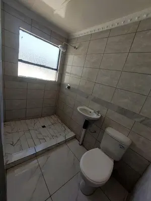 a bathroom with a toilet and a sink at Baraba's guest house in Nelspruit