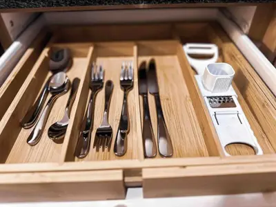 a wooden drawer with utensils in a kitchen at Luxurious 2 bedroom Apartment! in Centurion