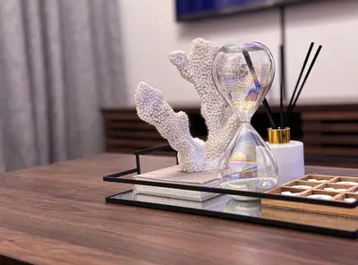 a glass clock with crystals on a table at Luxurious 2 bedroom Apartment! in Centurion