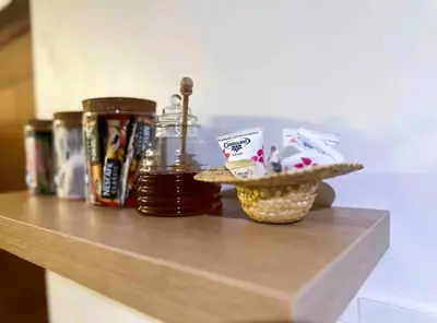 a counter top with a bowl of food and a drink at Luxurious 2 bedroom Apartment! in Centurion