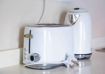 a white toaster sitting on top of a counter at Luxury on New in Midrand