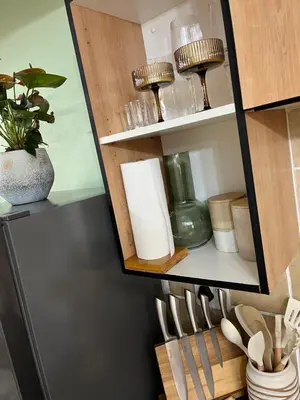 a cabinet filled with lots of kitchen utensils at Luxury Loft eMalahleni in Witbank