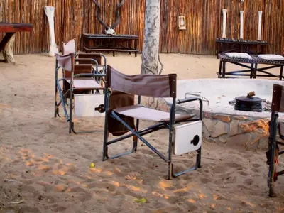 a group of chairs sitting next to a table at Tintshaba Safaris in Phalaborwa