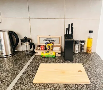 a cutting board sitting on top of a kitchen counter at Private Garden Home Fast WiFi in Centurion