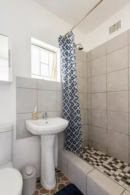 a bathroom with a sink and a toilet at Private Garden Home Fast WiFi in Centurion