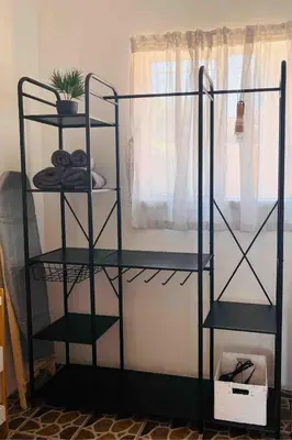 a black shelving unit in a room with a window at Private Garden Home Fast WiFi in Centurion