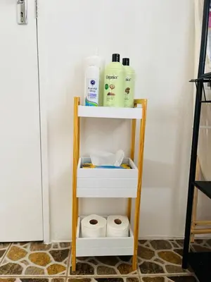a shelf with bottles and toilet paper in a room at Private Garden Home Fast WiFi in Centurion