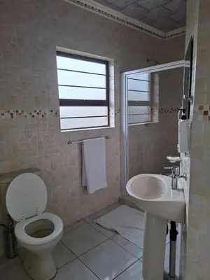 a bathroom with a toilet and a sink at Entire Modern House!!- Middelburg in Middelburg