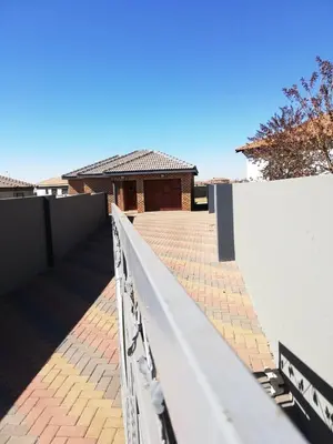 a white fence in front of a house at Entire Modern House!!- Middelburg in Middelburg