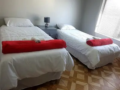 two beds sitting next to each other in a bedroom at Entire Modern House!!- Middelburg in Middelburg