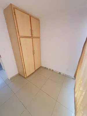a room with a cabinet and a tiled floor at Private Suite in Polokwane