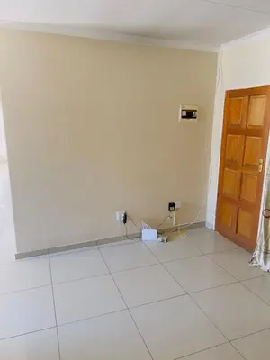 an empty room with a door and a tile floor at Private Suite in Polokwane