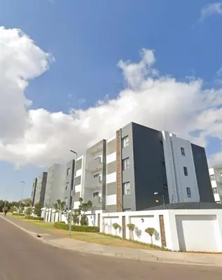 a large building on the side of a street at Reece Luxury Midrand Suite in Midrand