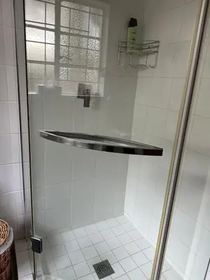 a shower with a glass door in a bathroom at Tranquil view lodge in Haenertsburg