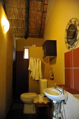 a bathroom with a toilet and a sink at Palmwag Tzaneen in Tzaneen