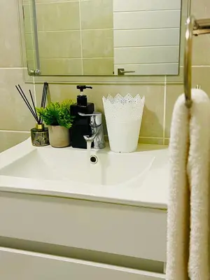 a bathroom sink with plants and a mirror at Lagoon - The Blyde in Pretoria